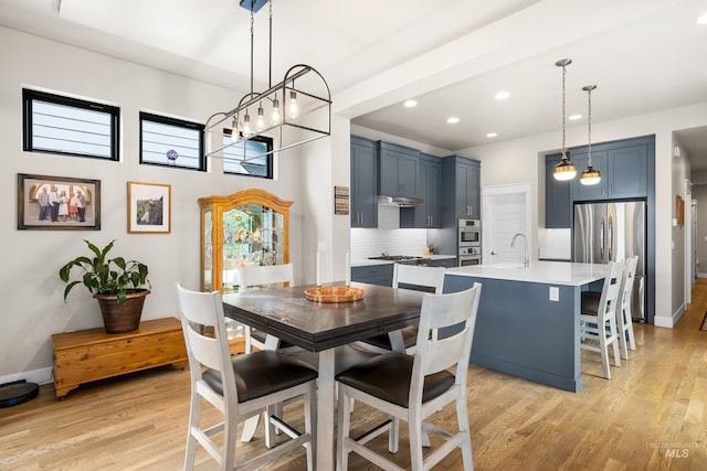 11684 N 23rd Ave, Boise, ID 83714 - dining space featuring light wood finished floors, recessed lighting, and baseboards
