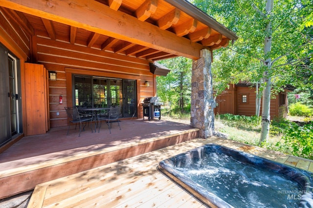 view of swimming pool featuring a deck and area for grilling