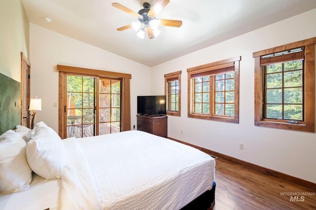 bedroom with ceiling fan, lofted ceiling, dark hardwood / wood-style floors, and access to exterior