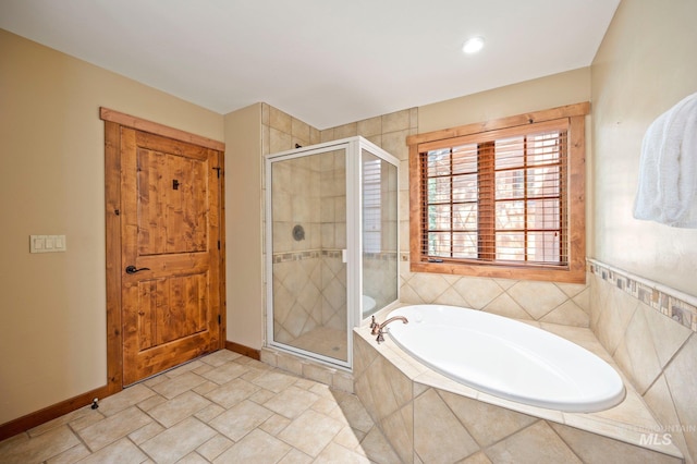 bathroom featuring independent shower and bath and tile patterned flooring