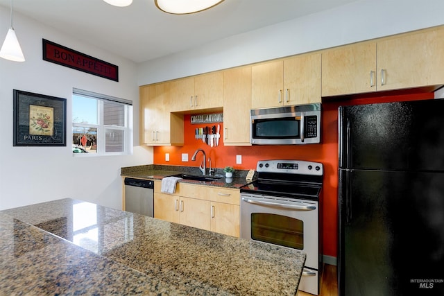502 S 15th St # 104, Boise, ID 83702 - kitchen featuring pendant lighting, light brown cabinets, stainless steel appliances, and a sink