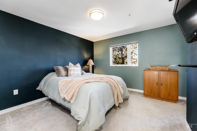 502 S 15th St # 104, Boise, ID 83702 - bedroom featuring baseboards and light colored carpet