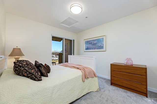 502 S 15th St # 104, Boise, ID 83702 - carpeted bedroom featuring attic access, baseboards, and a closet