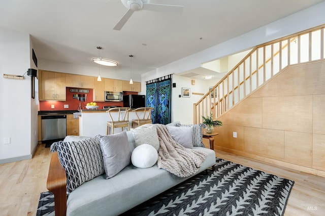 502 S 15th St # 104, Boise, ID 83702 - living area with stairway, ceiling fan, and light wood-type flooring
