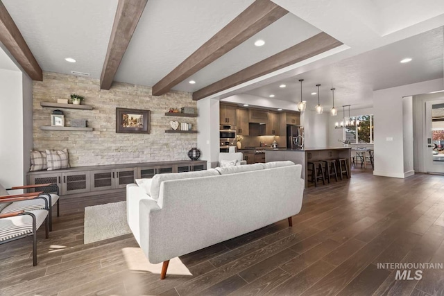 living room with beam ceiling, recessed lighting, baseboards, and dark wood-style flooring