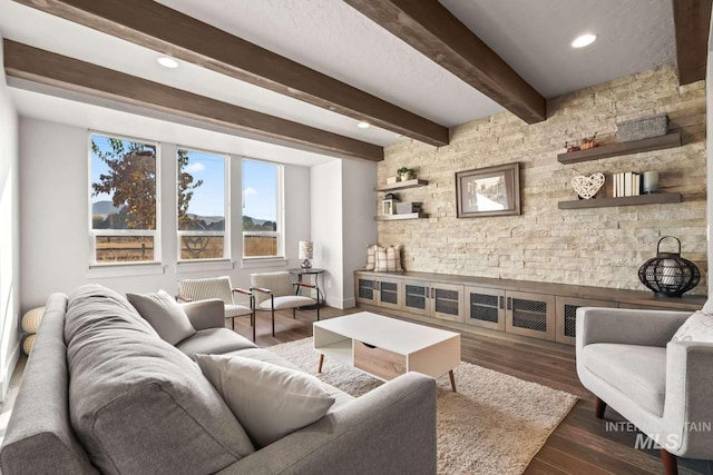 living area with recessed lighting, beam ceiling, and wood finished floors