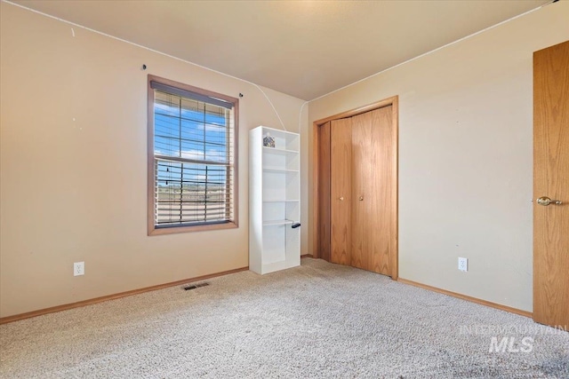 11716 S Emerald Rd, Nampa, ID 83686 - unfurnished bedroom with carpet, baseboards, and a closet