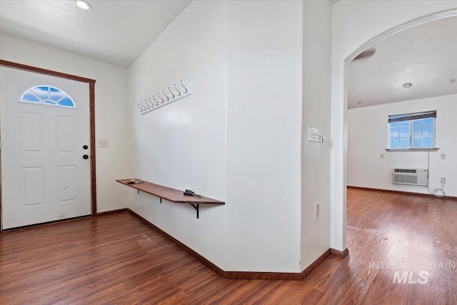 11716 S Emerald Rd, Nampa, ID 83686 - foyer featuring arched walkways, dark wood-type flooring, and baseboards