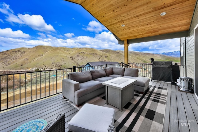 44 Shoemaker Dr, Horseshoe Bend, ID 83629 - wooden deck featuring an outdoor living space and a mountain view