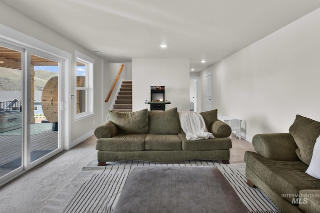 44 Shoemaker Dr, Horseshoe Bend, ID 83629 - carpeted living room with baseboards, stairway, and recessed lighting