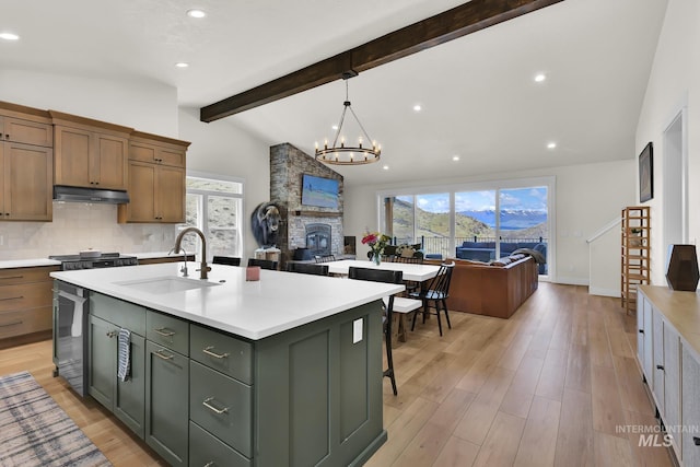 44 Shoemaker Dr, Horseshoe Bend, ID 83629 - kitchen featuring a sink, open floor plan, light countertops, and recessed lighting