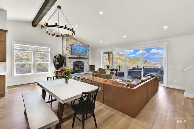 44 Shoemaker Dr, Horseshoe Bend, ID 83629 - living area with a fireplace, a chandelier, light wood-type flooring, and recessed lighting