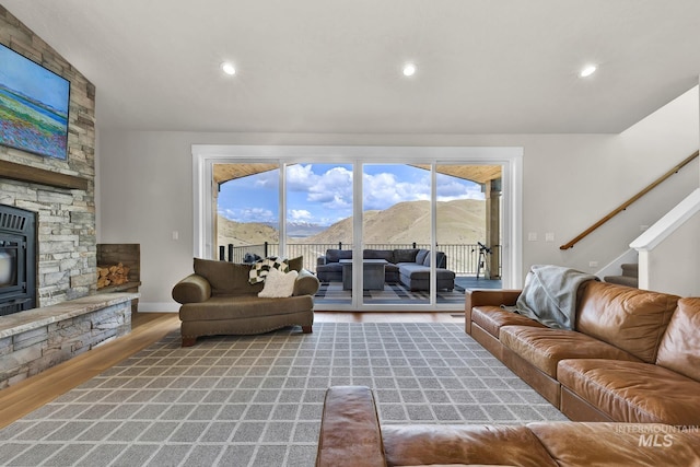 44 Shoemaker Dr, Horseshoe Bend, ID 83629 - living room with wood finished floors, a mountain view, healthy amount of natural light, stairs, and recessed lighting