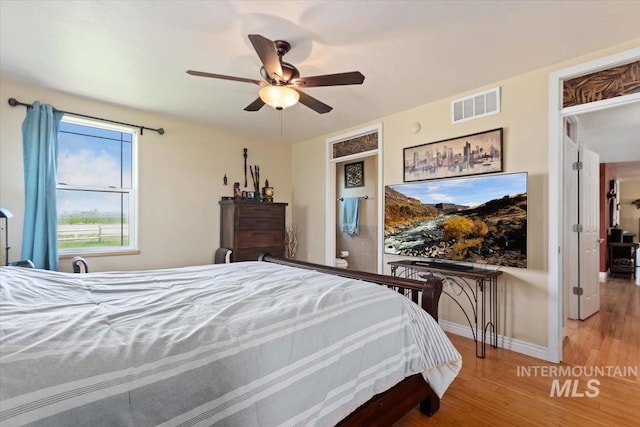 bedroom with light wood-type flooring and ceiling fan