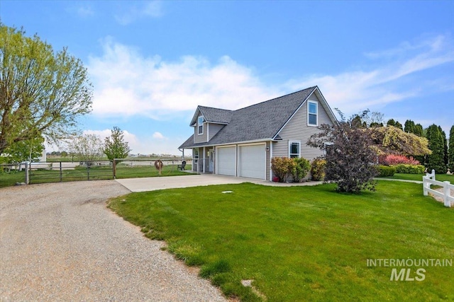 view of side of property featuring a yard