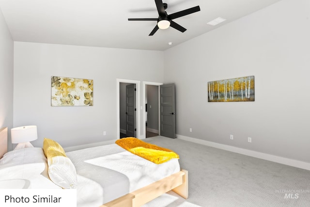 bedroom featuring a ceiling fan, baseboards, visible vents, lofted ceiling, and light colored carpet