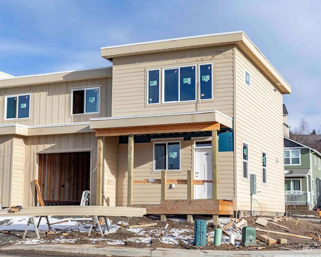 view of front of house featuring board and batten siding and an attached garage