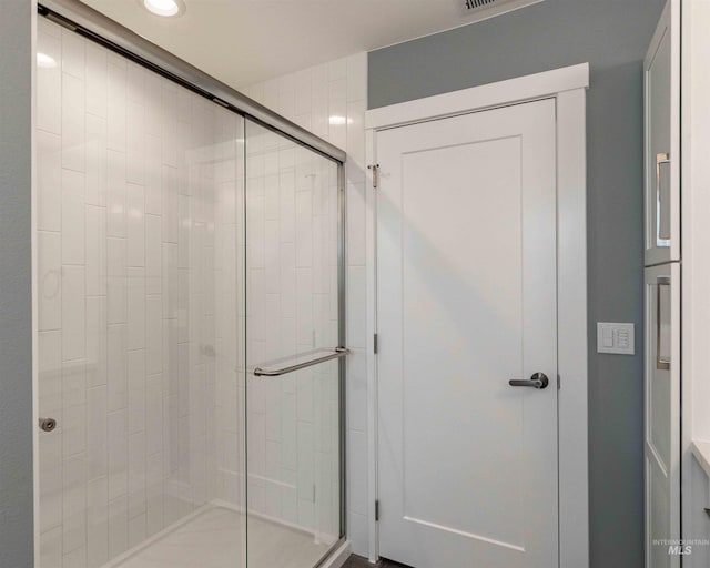 bathroom with a stall shower