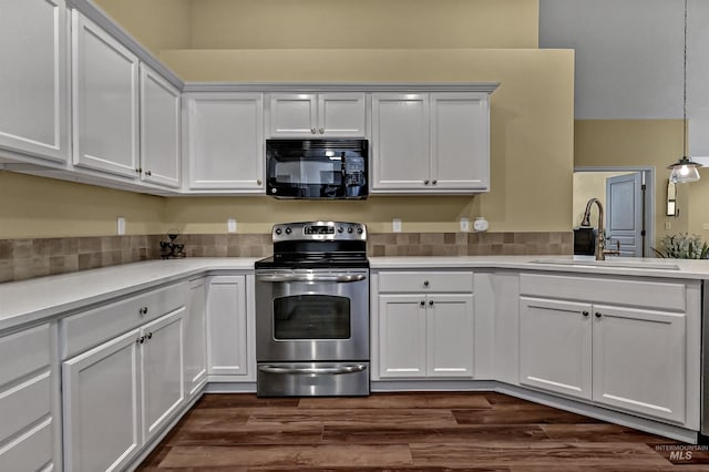 2814 N Cloverdale, Boise, ID 83713 - kitchen with black microwave, electric stove, light countertops, white cabinets, and dark wood-type flooring