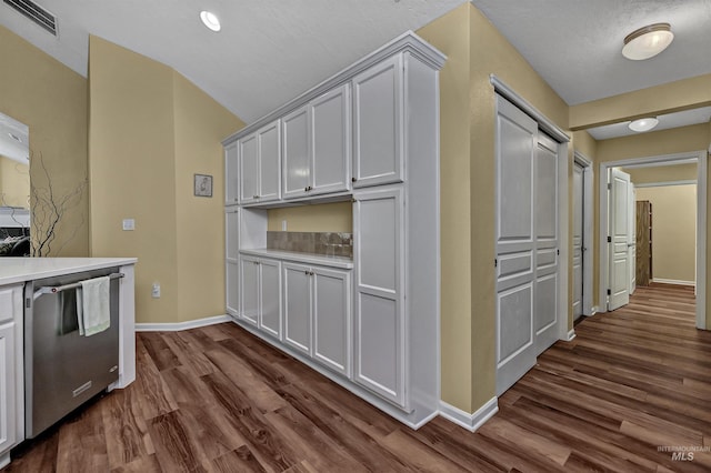 2814 N Cloverdale, Boise, ID 83713 - kitchen with stainless steel dishwasher, dark wood finished floors, light countertops, and lofted ceiling