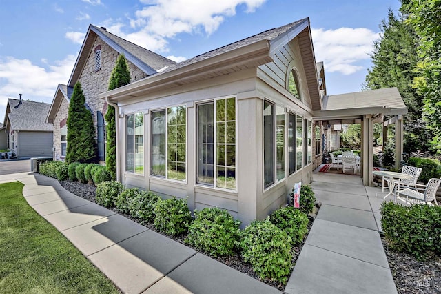 2814 N Cloverdale, Boise, ID 83713 - view of side of home with a sunroom