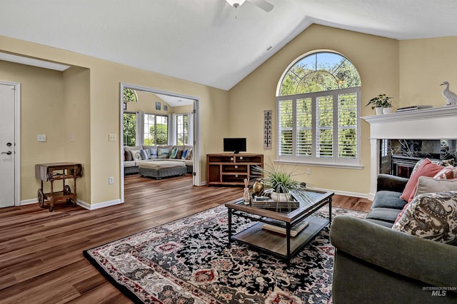 2814 N Cloverdale, Boise, ID 83713 - living room with plenty of natural light, ceiling fan, vaulted ceiling, wood finished floors, and a premium fireplace