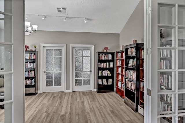 2814 N Cloverdale, Boise, ID 83713 - interior space with wood finished floors and a chandelier