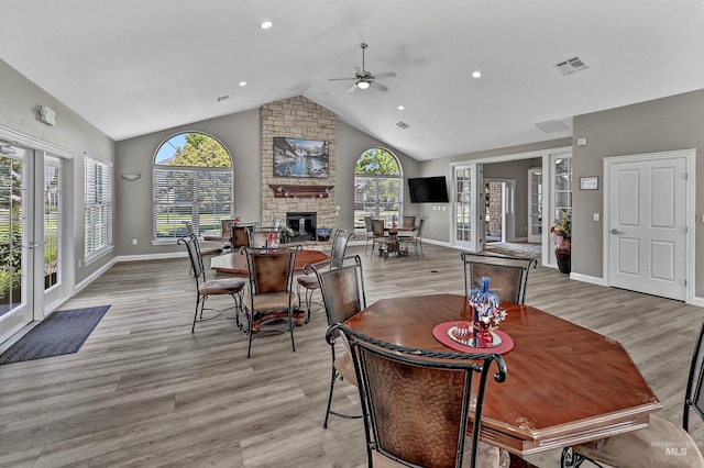 2814 N Cloverdale, Boise, ID 83713 - dining room featuring ceiling fan, light wood-style floors, a large fireplace, recessed lighting, and high vaulted ceiling