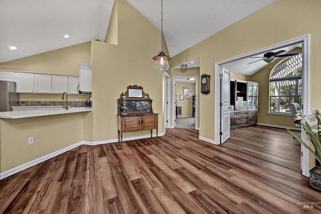 2814 N Cloverdale, Boise, ID 83713 - living room with dark wood-style flooring, a ceiling fan, and high vaulted ceiling