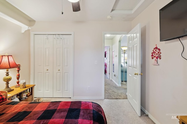 bedroom featuring carpet floors, a closet, and ceiling fan