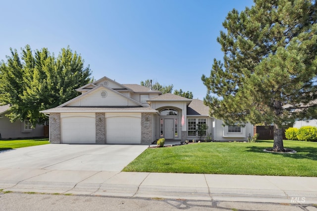 view of front of house with a front yard and a garage