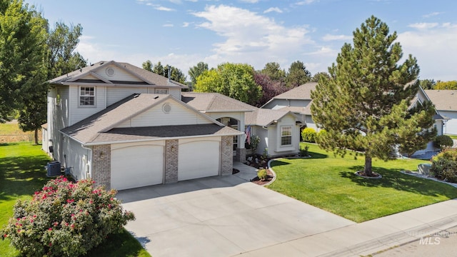 view of front of home with a garage, central AC unit, and a front yard