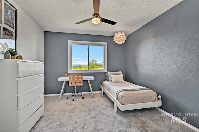 2942 E Eastgate Dr, Boise, ID 83716 - bedroom with carpet flooring, a textured ceiling, baseboards, and a ceiling fan