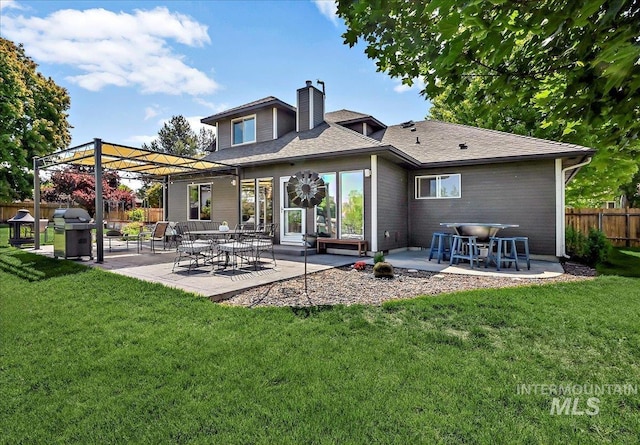 2942 E Eastgate Dr, Boise, ID 83716 - rear view of house with a chimney and a patio