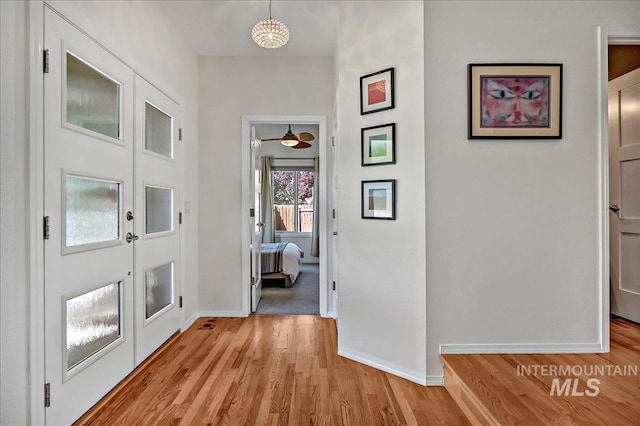 2942 E Eastgate Dr, Boise, ID 83716 - foyer featuring light wood-style floors and baseboards