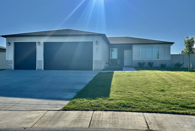 837 Trout Creek Way, Kimberly, ID 83314 - ranch-style house with an attached garage, a front lawn, driveway, and a shingled roof