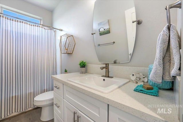 837 Trout Creek Way, Kimberly, ID 83314 - full bath with vanity, a shower with curtain, and wood finished floors