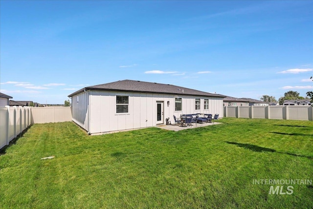 837 Trout Creek Way, Kimberly, ID 83314 - back of property with board and batten siding, a fenced backyard, and a patio
