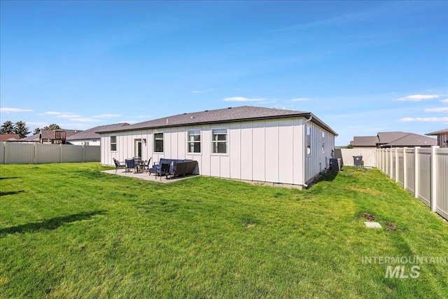 837 Trout Creek Way, Kimberly, ID 83314 - back of house with board and batten siding, a fenced backyard, and a patio