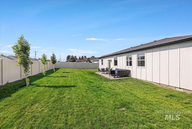 837 Trout Creek Way, Kimberly, ID 83314 - fenced backyard featuring a patio area and an outdoor hangout area