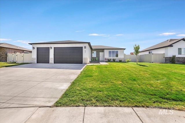 837 Trout Creek Way, Kimberly, ID 83314 - view of front of property with an attached garage, concrete driveway, a gate, and stucco siding