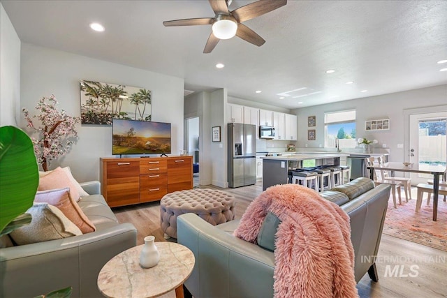 837 Trout Creek Way, Kimberly, ID 83314 - living room with light wood finished floors, ceiling fan, and recessed lighting