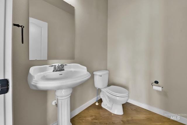 3031 N Christian Way, Meridian, ID 83646 - bathroom featuring baseboards and wood finished floors