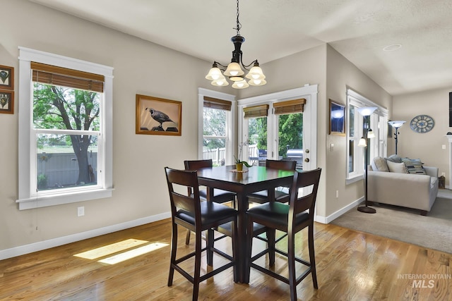 3031 N Christian Way, Meridian, ID 83646 - dining room with a chandelier, healthy amount of natural light, and light wood-style floors