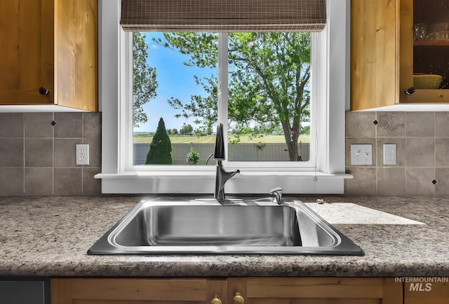 3031 N Christian Way, Meridian, ID 83646 - kitchen view of backsplash, glass insert cabinets, and light stone countertops