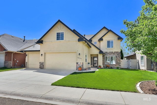 3031 N Christian Way, Meridian, ID 83646 - view of front facade featuring stone siding, stucco siding, driveway, and a garage