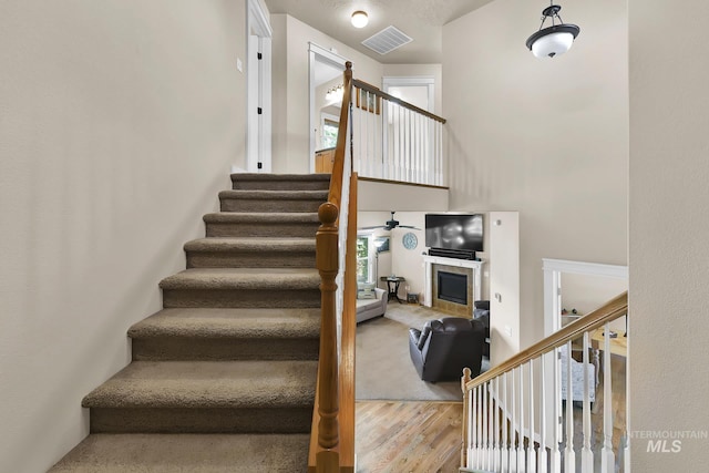 3031 N Christian Way, Meridian, ID 83646 - stairs with wood finished floors, a fireplace, and ceiling fan