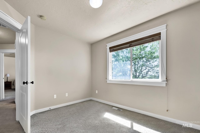 3031 N Christian Way, Meridian, ID 83646 - carpeted spare room with a textured ceiling and a smoke detector