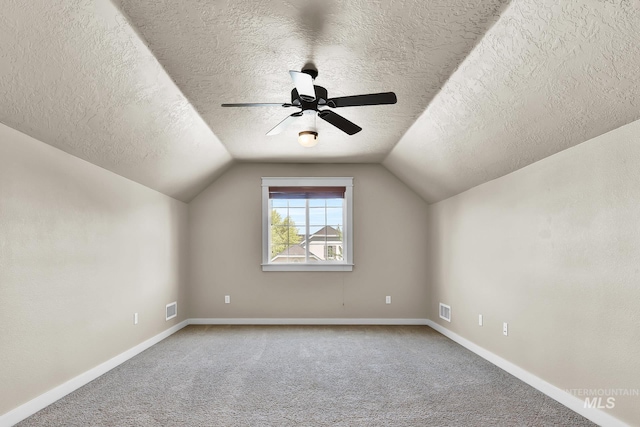 3031 N Christian Way, Meridian, ID 83646 - bonus room featuring a textured ceiling, carpet flooring, ceiling fan, and vaulted ceiling