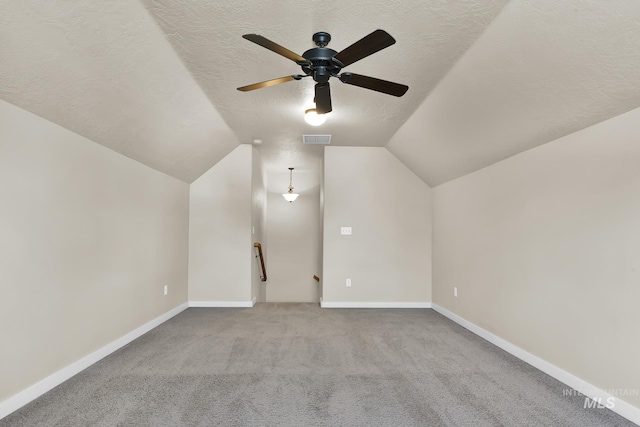 3031 N Christian Way, Meridian, ID 83646 - bonus room with a textured ceiling, a ceiling fan, lofted ceiling, and carpet flooring